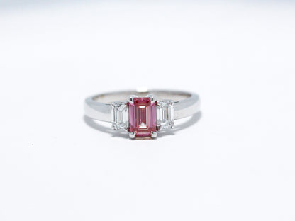 Pink emerald cut with white side stones