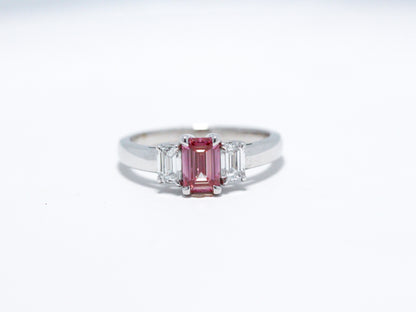 Pink emerald cut with white side stones