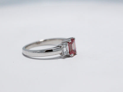 Pink emerald cut with white side stones